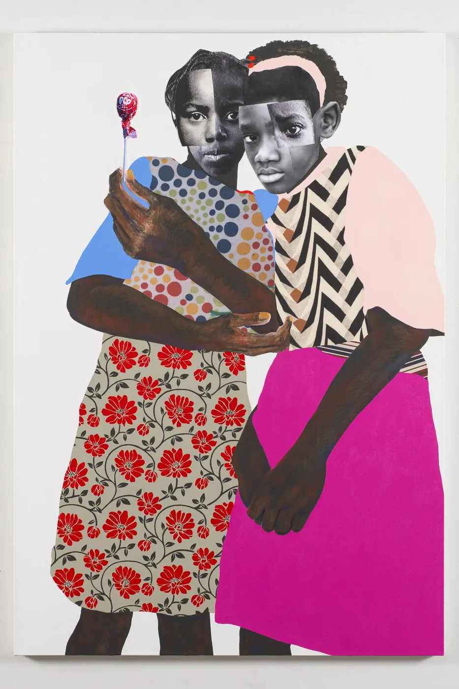 A collage painting of two girls in patterned dresses, one holding a lollipop